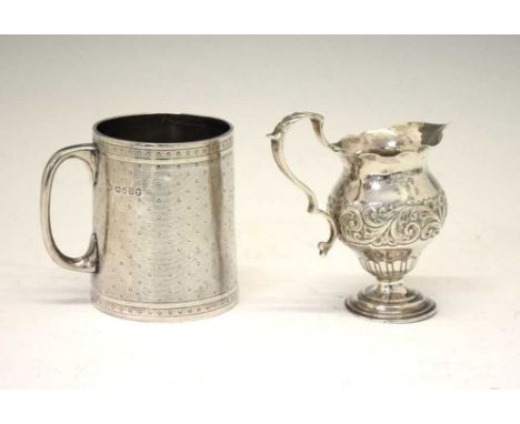 Victorian silver christening mug with engine turned decoration, London 1873, and a Victorian silver cream jug, Sheffield 1887