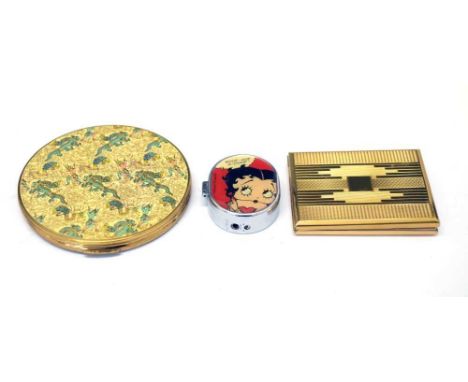 Betty Boop lighter and two compacts, largest 10cm diameter 
