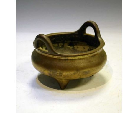 Chinese bronze tripod incense burner, of two-handled cauldron form with pseudo six character seal mark beneath, 13.5cm across