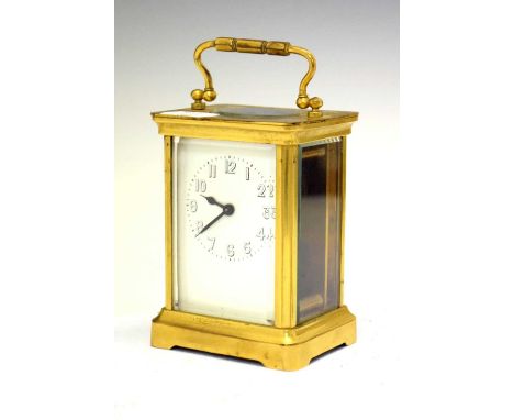Brass cased carriage clock having a white Arabic dial, 11cm high (ex. handle) 
