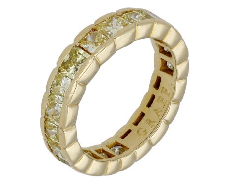 A coloured diamond eternity ring by Graff, set with a continuous row of princess-cut diamonds of yellow tint, (diamonds untes