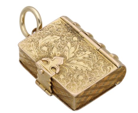 A late 19th century gold locket, realistically modelled as a book, with engraved foliate decoration, opening to reveal two ov