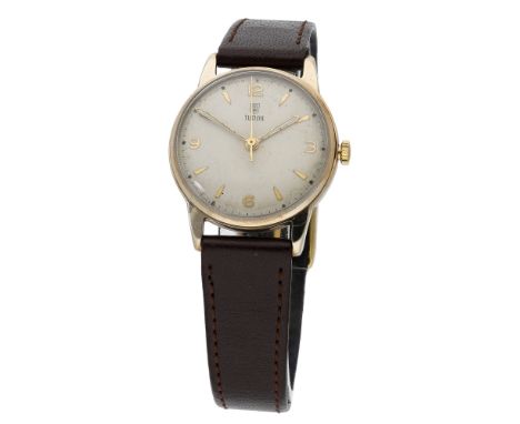 Tudor. A gold wristwatch, Ref. 12856, circa 1955. Movement: manual winding, 15 jewels. Dial: silvered, applied Arabic and dag