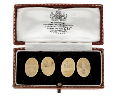 A pair of 9ct gold cufflinks for The Worshipful Company of Drapers by Cropp &amp; Farr, the oval panels engraved with crest a