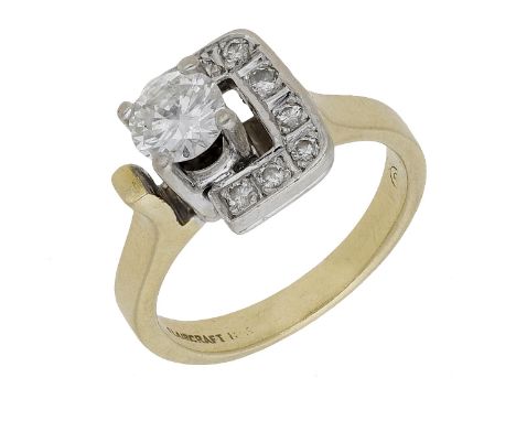 A diamond ring, of stylised geometric form, the principal brilliant-cut diamond claw-set within a semi square surround of sim