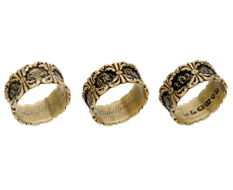 A 19th century gold memorial ring, with recessed black enamel detail and gold lettering to the exterior ‘IN ME MO RY OF’ with
