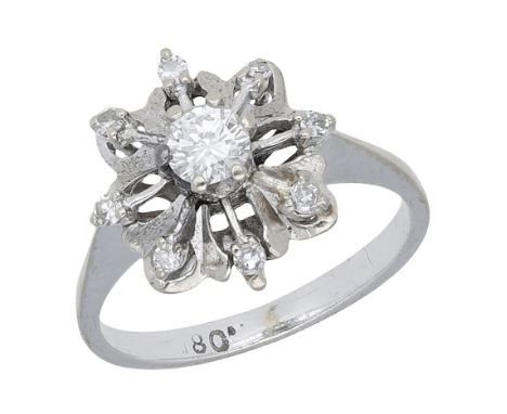 A diamond cluster ring, of stylised flowerhead design, set with brilliant and single-cut diamonds, total diamond weight appro
