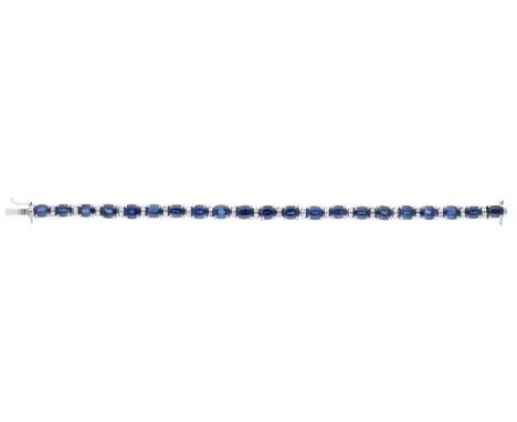 A sapphire and diamond line bracelet, set throughout with oval mixed-cut sapphires spaced by pairs of single-cut diamonds, to
