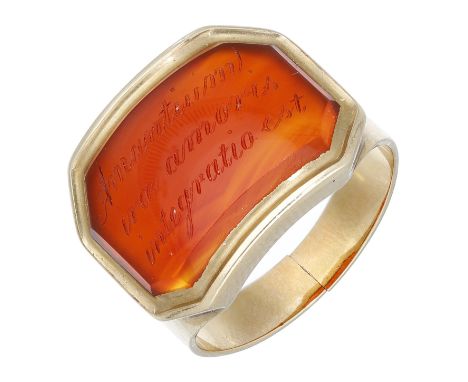 An early 19th century carnelian panel ring, the curved panel inscribed with Latin script ‘Amantium irae amoris integratio est