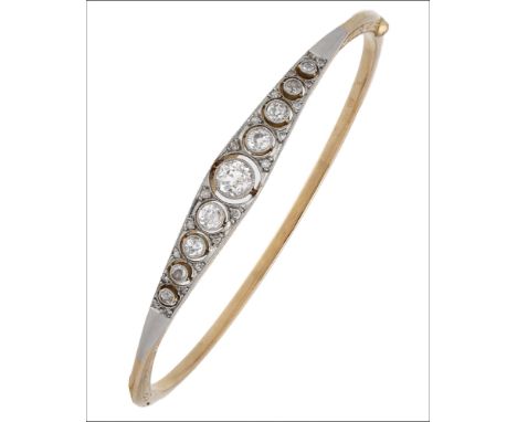 An early 20th century diamond bangle and bar brooch suite, set to the front with a row of graduated old brilliant-cut diamond