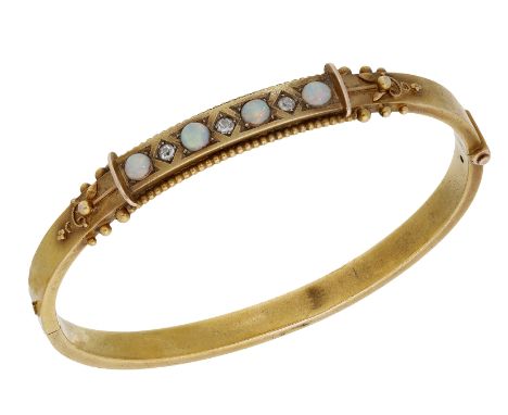 A mid - late 19th century opal and diamond bangle, the hinged bangle with bloomed finish, the front set with an alternating r