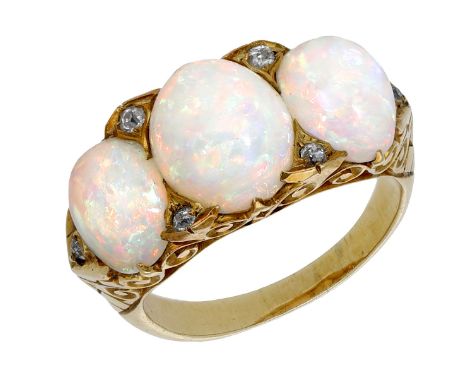 A late 19th century opal three stone ring, the graduated opal cabochons with diamond highlights between, to a scrollwork gall