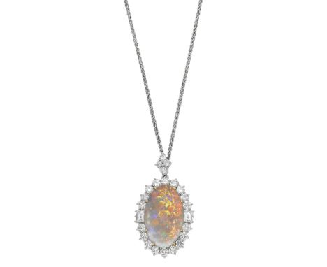 An opal and diamond brooch / pendant, the oval opal cabochon within a surround of brilliant-cut diamonds with step-cut diamon