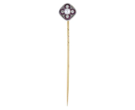An early 20th century ruby, pearl and diamond stick pin, the cushion-shaped terminal set with a quatrefoil of old brilliant-c