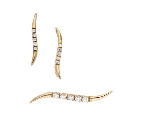 A brooch and earring suite by Saks Fifth Avenue, the scroll-shaped brooch set with a row of circular-cut white cubic zirconia