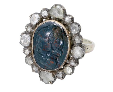 An early 19th century bloodstone intaglio and diamond ring, the oval bloodstone carved to depict the profile of a classical m