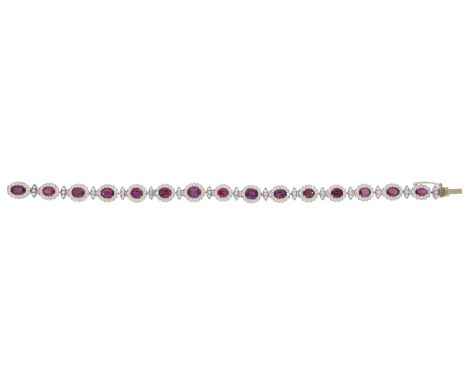 A ruby and diamond line bracelet, the oval-cut ruby and brilliant-cut diamond clusters spaced by similarly-set navette-shaped