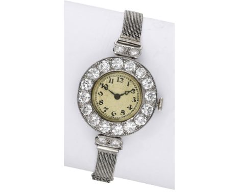 Swiss. A lady’s platinum and diamond-set cocktail watch, circa 1920.  Movement: manual winding, 15 jewels. Dial: silvered, Ar