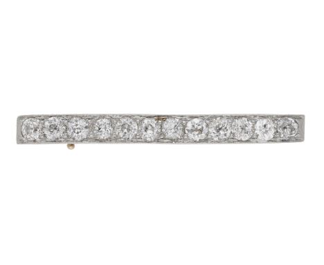 An early 20th century diamond set bar brooch, set throughout with old brilliant-cut diamonds, mounted in platinum and gold, t