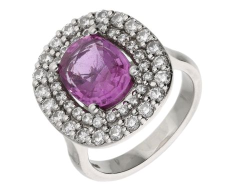A pink sapphire and diamond cluster ring, the oval-cut pink sapphire within a two-row surround of brilliant-cut diamonds, mou
