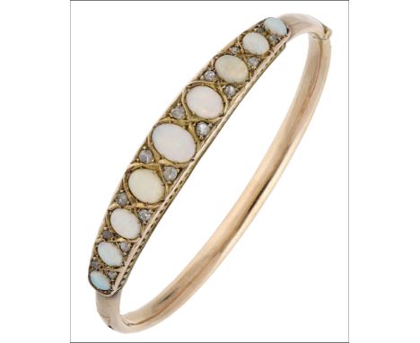 An opal and diamond bangle, the front set with a row of graduated opal cabochons, spaced by pairs of rose-cut diamonds, inner