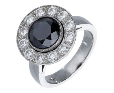 A black diamond and diamond cluster ring, the brilliant-cut treated black diamond in a surround of similarly-cut diamonds, st