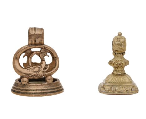 Two early 19th century fob seals, the first gilt copper, of scrollwork form modelled as a dolphin, inset with moulded glass i