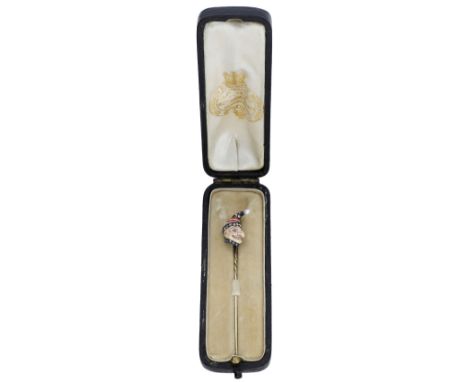A late 19th century ‘Punch’ stick pin, the ‘Punch’ head terminal realistically decorated in polychrome enamel, with rose-cut 