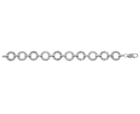A diamond bracelet, the pierced disc-shaped links alternately set with brilliant-cut diamonds, total diamond weight approxima