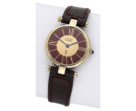 Must de Cartier. A lady’s gold plated wristwatch, Ref. 119213, circa 1990. Movement: quartz. Dial: gilt with burgundy backgro