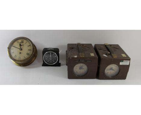 A brass cased ships clock by Smiths of London manual wind movement - 17cm diameter together with two German made pigeon timer