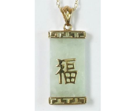 A 9ct gold mounted jade (untested) pendant, chain 