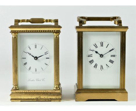 An English 8 day carriage clock brass cased beveled edged glass panels movement stamped "Made in England 7 Jewls" white ename