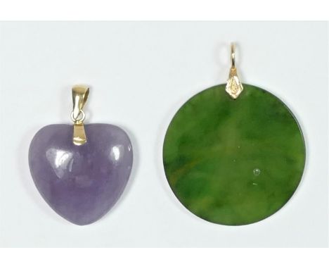 A gold mounted nephrite jade disc pendant, 26mm and a stained lavender jadeite pendant (2) 