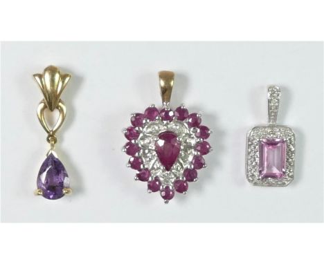 A 9ct gold ruby and diamond chip heart shape pendant 15 x 13mm, an amethyst pendant and a topaz pendant