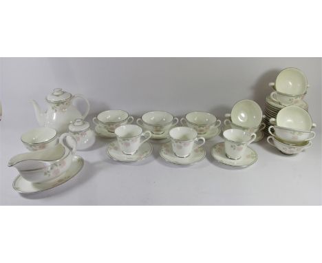 A Royal Doulton 'Twilight' dinner/tea service, together with a part dinner service by Westbury 'Elizabethan' (4) 