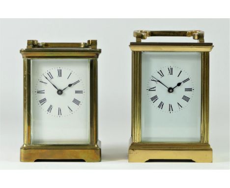 Two brassed cased manual wind mantle clocks, white enameled dials with beveled edge glass panels - 13cm tall (2) 