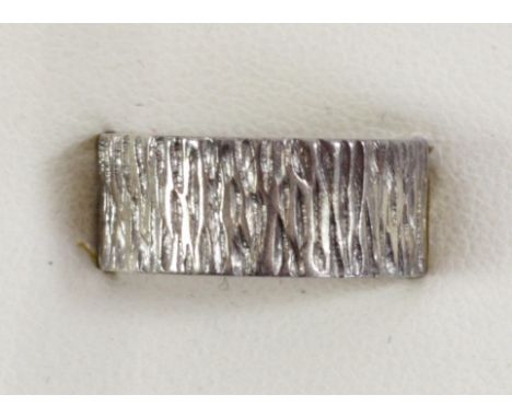 A 9ct white gold bark finish band ring, Birmingham 1971, K, 5.2gm 