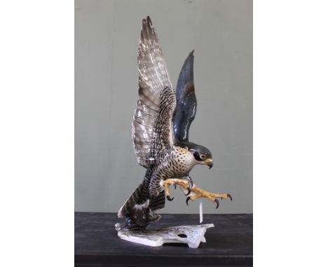 A ceramic Peregrine Falcon by Hutschenreuther, height including base 23"