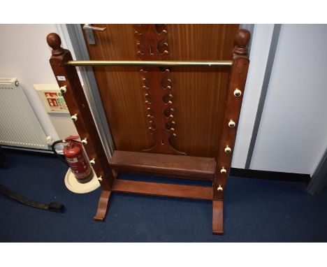TWO VARIOUS MODERN SWORD RACKS OR STANDS, both floor standing, the first for 24 swords, the second for 10 and a carved Burmes