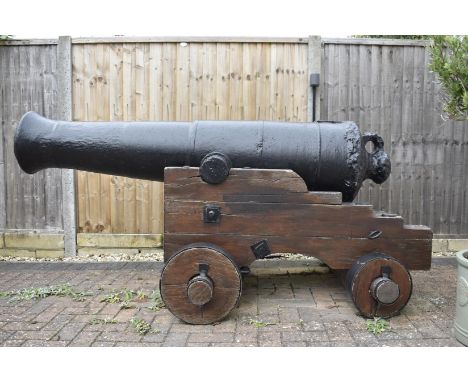 A TRAFALGAR ERA 18 POUNDER BLOOMFIELD CANNON, the characteristic cast iron six stage body with plain trunnions and typical bl