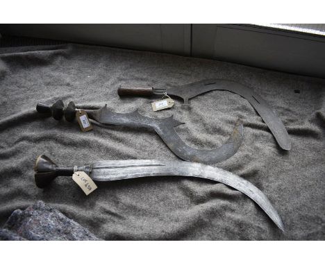 TWO VARIOUS AFRICAN THROWING KNIVES AND A SHORT SWORD, the first of sickle form with channelled border and stippled geometric