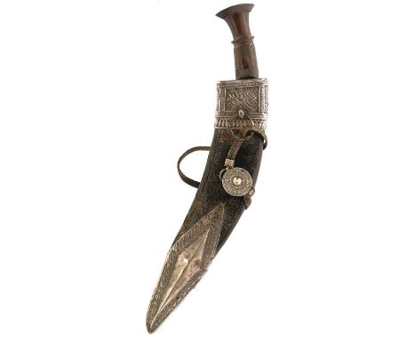 A 19TH CENTURY WHITE METAL MOUNTED NEPALESE OR NORTH INDIAN KUKRI, 32cm double fullered blade, characteristic scroll carved h