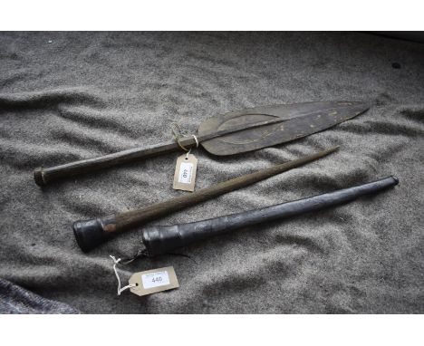 AN EARLY 20TH CENTURY TRIBAL STILETTO DAGGER, 47cm over all, the tapering wooden spike wrapped in ray skin, contained in its 