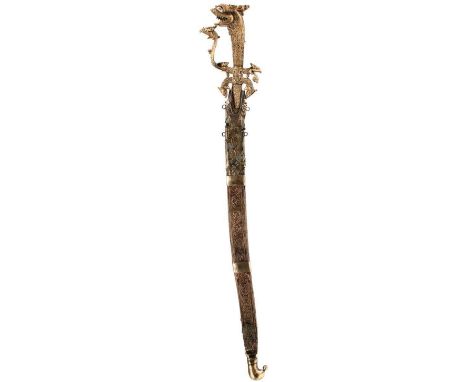 A SINHALESE OR CEYLONESE KASTANE OR SHORT SWORD, 37.5cm curved fullered blade, patinated and chipped, with foliate engraved w