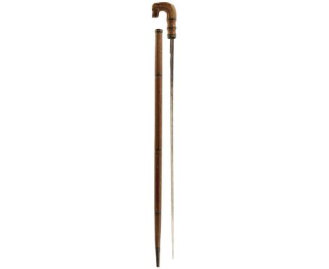 A 17TH CENTURY SWORD STICK, 64.5cm triangular section incurved blade with later repair, the handle carved as a dog, the haft 