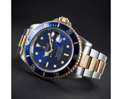 A GENTLEMAN'S STEEL &amp; GOLD ROLEX OYSTER PERPETUAL DATE SUBMARINER BRACELET WATCH CIRCA 1989, REF. 16613 WITH RARE PURPLE 