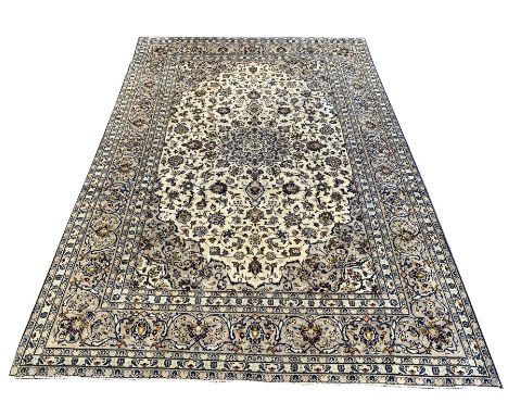 Persian fine Kashan ivory ground carpet, centred by floral medallion, triple guarded border Dimensions: Length/Width:&nbsp;35