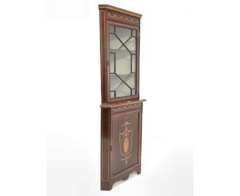 Edwardian mahogany floor standing display cabinet, dentil cornice over swag and chequered band inlay and astragal glazed door