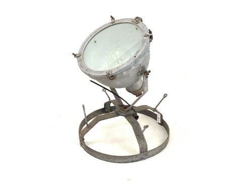 Early to mid 20th century industrial metal spot light/ search light, on a circular adjustable base H75cm